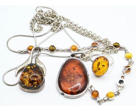 Silver jewellery set with amber, comprising ring, bracelet and two necklaces. Gross weight 56.5g 