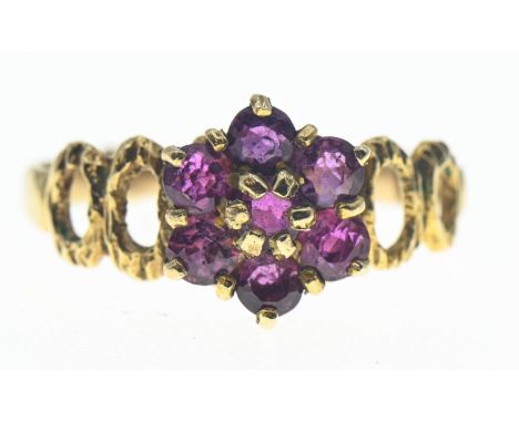 Pink sapphire, flower cluster ring on 9ct gold featuring openwork shoulders. Gross weight 2.27g 