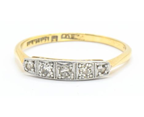 Diamond set ring. Five diamonds in square millgrain white metal on 18ct yellow gold. Size O. Gross weight 1.73g