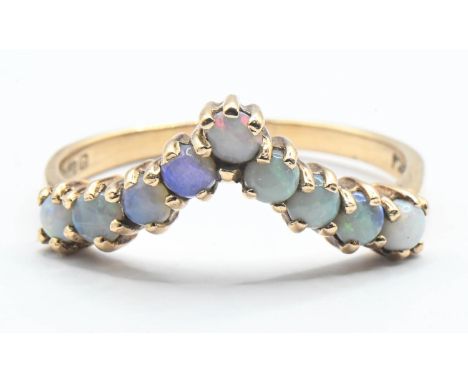 9ct gold and nine opal wishbone ring. Size R 1/2, gross weight 2.64gms 