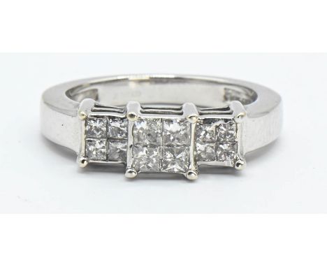 18ct white gold and diamond ring featuring twelve princess cut diamonds, size J, gross weight 5.10 grams 