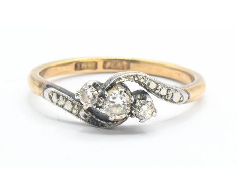 18ct gold and diamond crossover ring, size M 1/2. Gross weight 2.62g. 