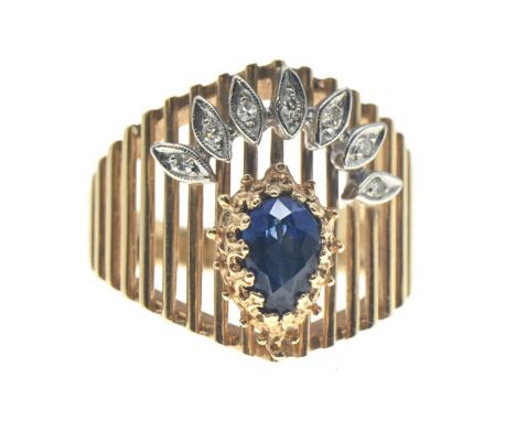 14ct gold ring (marked 14 but rubbed) set with pear shaped sapphire and a fan of small white sapphires on an openwork back. S