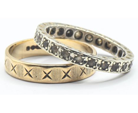 Two 9ct gold rings, including an eternity ring set with white stones and the other with a continuous cross design, size M1/2 
