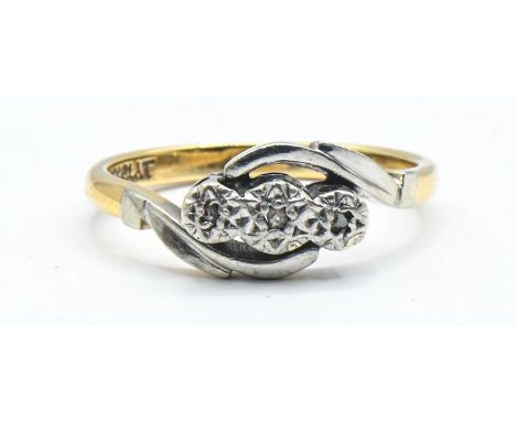 Crossover ring, gypsy set with three small diamonds on platinum set into a 9ct gold shank.  Size M. Gross weight 2.36g  