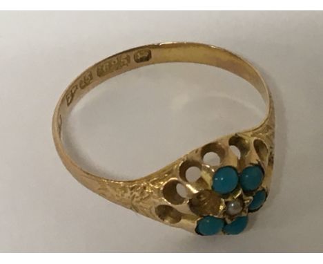 A Vintage 15carat gold ring set with turquoise and seed pearl one missing. Weight 2g