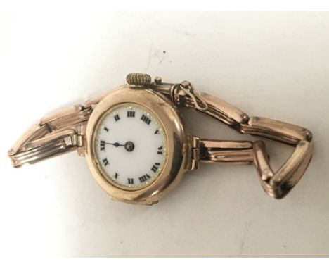 A Vintage gold ladies watch 9carat gold with an expandable bracelet strap attached the bracelet without hallmarks.