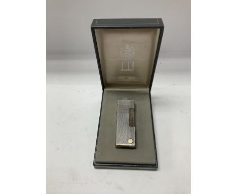 A vintage cased Dunhill lighter with original outer box.