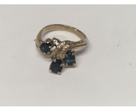 A 14 k gold ring inset with gem stones size L total weight 3.6 grams.