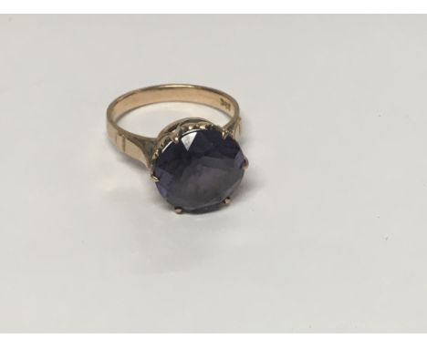 A 14 k gold ring inset with gem stone size L total weight 4 grams.