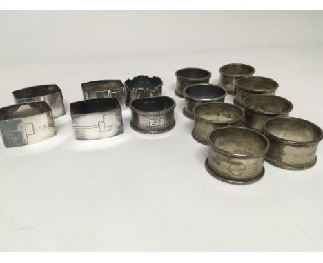 A collection of silver napkin rings including engine turned napkin rings Art Deco design and others (a lot)