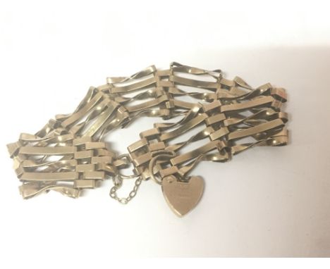 A 9carat gold gate bracelet with a heart padlock clasp weight 9.5g