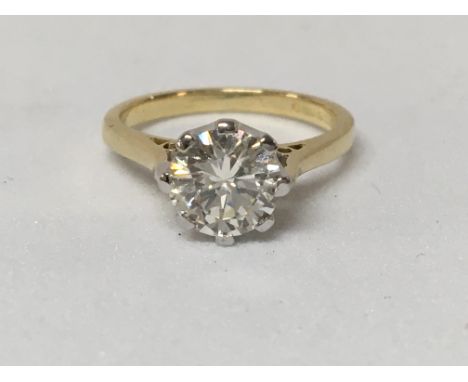 A 18 ct gold ring inset with a solitaire round cut Brilliant diamond 1.39 ct approx colour L size K/ L with independent diamo