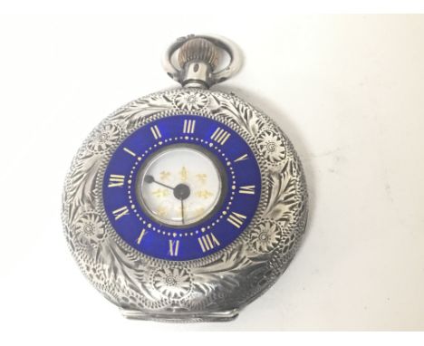 A decorative Antique silver button wind enamel decorated pocket watch.