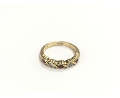 An 9ct gold half eternity ruby and diamond ring, approx 3.5g and approx size N.