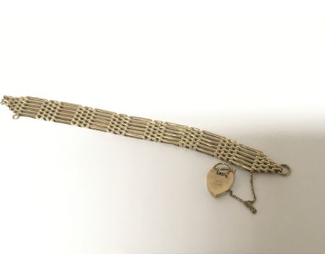 A quality 9carat gold gate bracelet with a padlock clasp. Weight 26.5g approximately.