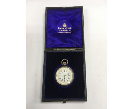 A silver cased pocket watch with white enamel dial having gold tone decoration.