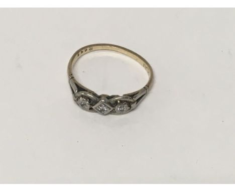 A 9 ct gold ring inset with three diamond chips size K total weight 1.4 grams