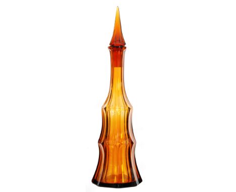 A large 1930s Moser glass decanter of stepped octagonal faceted form rising to a facet cut spire stopper all to an amber grou