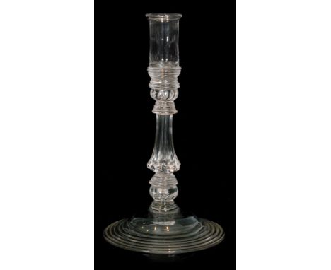 An 18th Century glass candlestick circa 1745, sleeve form sconce above beaded knop between collars over an eight sided Silesi