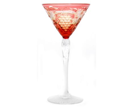 An early 20th Century Stevens and Williams Martini glass, the conical bowl cased in ruby over citron over clear and intaglio 