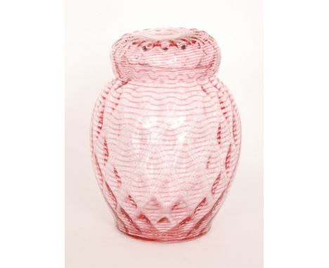  A 1930s Stevens and Williams glass jar and cover, of drawn ovoid form with a domed lid, decorated with pulled ruby trailing 