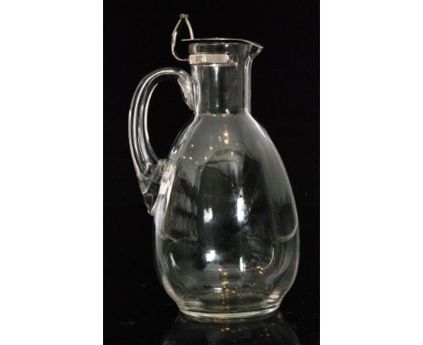 A late 19th Century crystal glass decanter designed by Dr Christopher Dresser of drawn fluted ovoid form below a sleeve form 