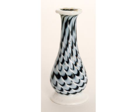 A late 18th Century Nailsea glass vase of footed baluster form with pulled opal trails and applied opal rim and foot, height 