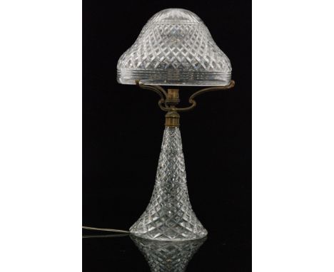 A large 1930s John Walsh Walsh clear crystal glass table lamp, the swept base rising to brass mounts and a domed shade, decor