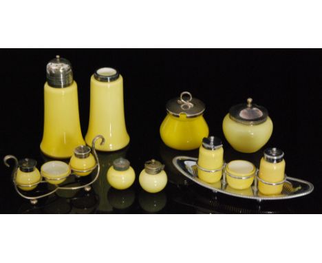 A group of 1920s John Walsh Walsh Primrose glass comprising cruet sets, a sugar sifter and two preserve jars, all in yellow o