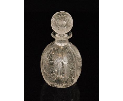 An early 20th Century Webb and Corbett crystal glass decanter of drawn ovoid form with ball stopper by Jack Lloyd, decorated 