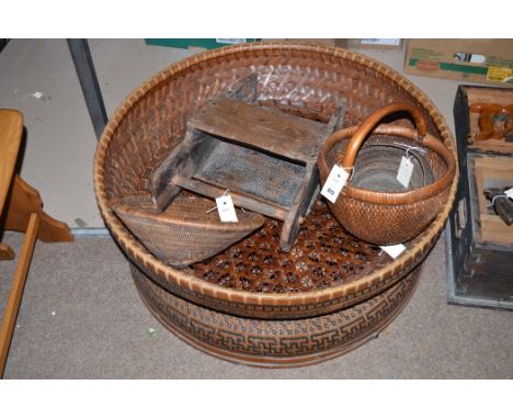 A Chinese rustic bucket or planter, 32cms wide; together with a Chinese rattan hat; a rattan water pourer; a rattan basket; a