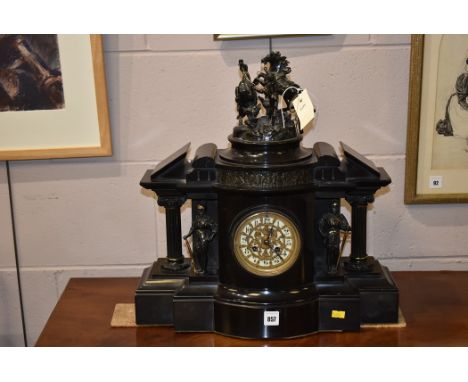 A late 19th century slate and pattinated brass mounted mantel clock. The top with Marley Horse design. 46cm wide