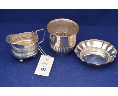 An Edward VII silver cup, by John Grinsell &amp; Sons, Birmingham 1902; an Elizabeth II silver dish; and a Victorian silver c