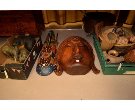 Ethnographica, to include: large carved Indonesian head; carved African tribal masks and a stick; woven baskets; vases; eleph