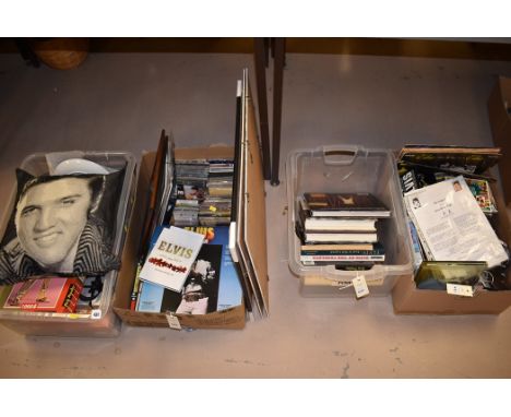 Elvis memorabilia, to include: books; mugs; CD's; vinyl; jigsaws; and a cushion, in four boxes.