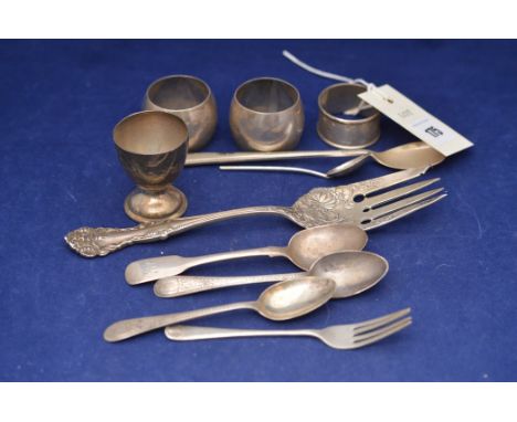 American silver fish serving fork stamped 'Sterling', with embossed floral decoration; silver napkin rings; an egg cup; teasp