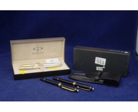 A Parker fountain pen and ball point pen in fitted case; together with two Montblanc fountain pens inscribed "Meisterstuck" i