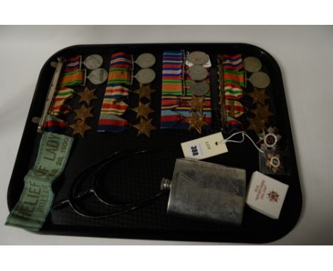 Four sets of WWII general service medals, Russian medals and a National Guard hip flask together with a set of spurs and a sa