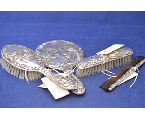 An Elizabeth II four piece dressing table set by W I Broadway &amp; Co, Birmingham 1982 comprising hand mirror, hairbrush, co