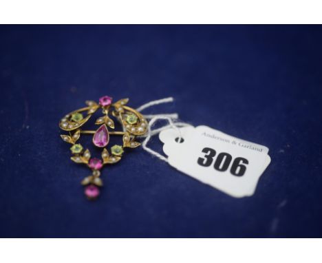 An Edwardian ruby, peridot and seed pearl brooch/pendant, in yellow metal mount, unmarked.
