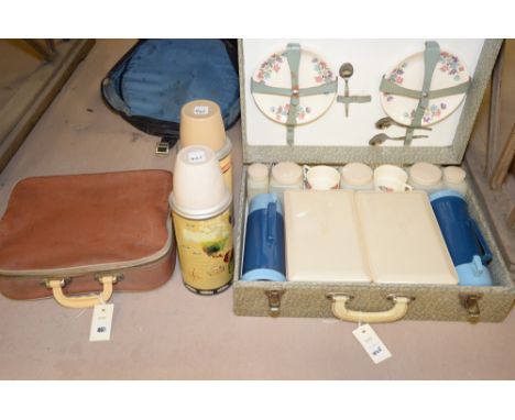A Sirram travelling picnic set together with two therms flasks and a further picnic set in leather case.