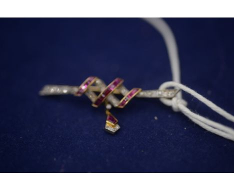 A late Victorian diamond and ruby set bar brooch, holding a kite-shaped drop,