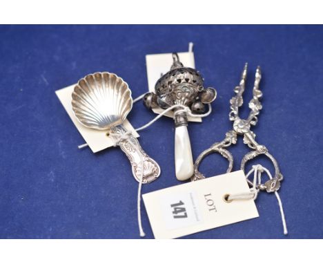 A Victorian silver caddy spoon by John Walton, Newcastle 1862, shell pattern; together with a silver and mother of pearl baby