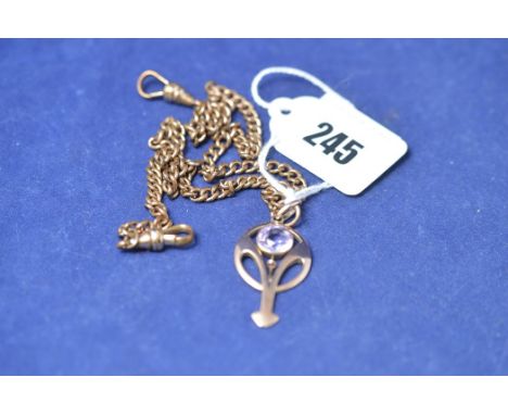A yellow metal and amethyst pendant, circa 1910, stamped '375', on gilt metal chain.