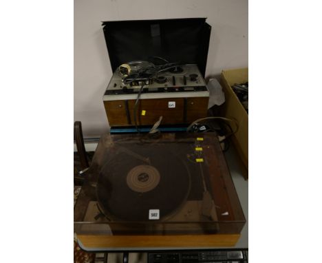 A Goldring Lenco GL75 record playing deck; an Akai 40,000 reel-to-reel tape records; a Sansui stereo amplifier;