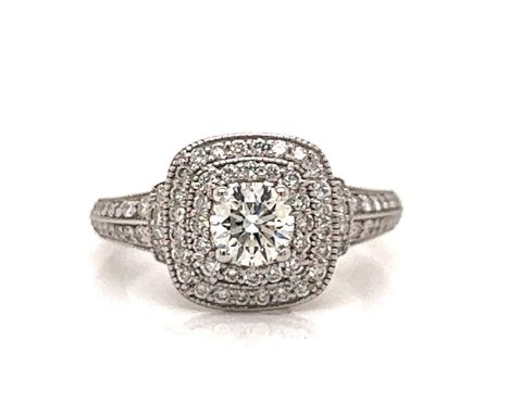 18K White Gold 1.30 Ct. Diamond Ring. &nbsp; &nbsp; Weighing 6.4 grams Set with an app. 0.55 Ct. Diamond in Center G Color, V