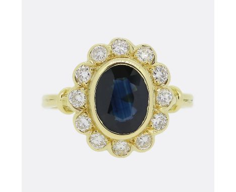 Vintage Sapphire and Diamond Cluster Ring.&nbsp; &nbsp; &nbsp; &nbsp; &nbsp; &nbsp; &nbsp; Weight:&nbsp;4.9 grams Size:&nbsp;