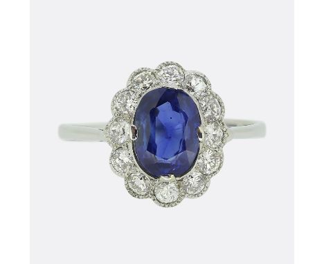 Vintage Sapphire and Diamond Cluster Ring.&nbsp; &nbsp; &nbsp; &nbsp; &nbsp; &nbsp; Weight:&nbsp;2.0 grams Ring Size:&nbsp;L 