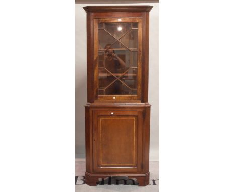 A George III style mahogany floor standing corner display cabinet on bracket feet, 76cm wide x 204cm high. 